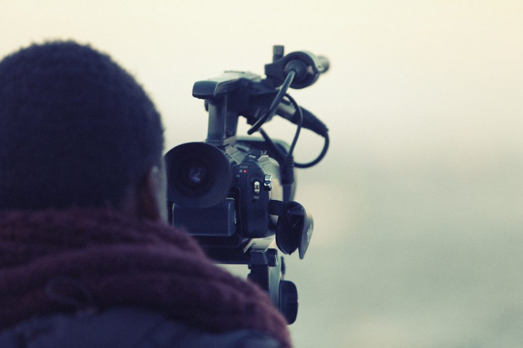 Person filming with a camera