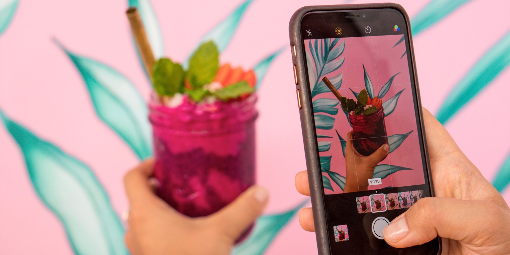 Photo being taken of a cocktail on a phone for instagram
